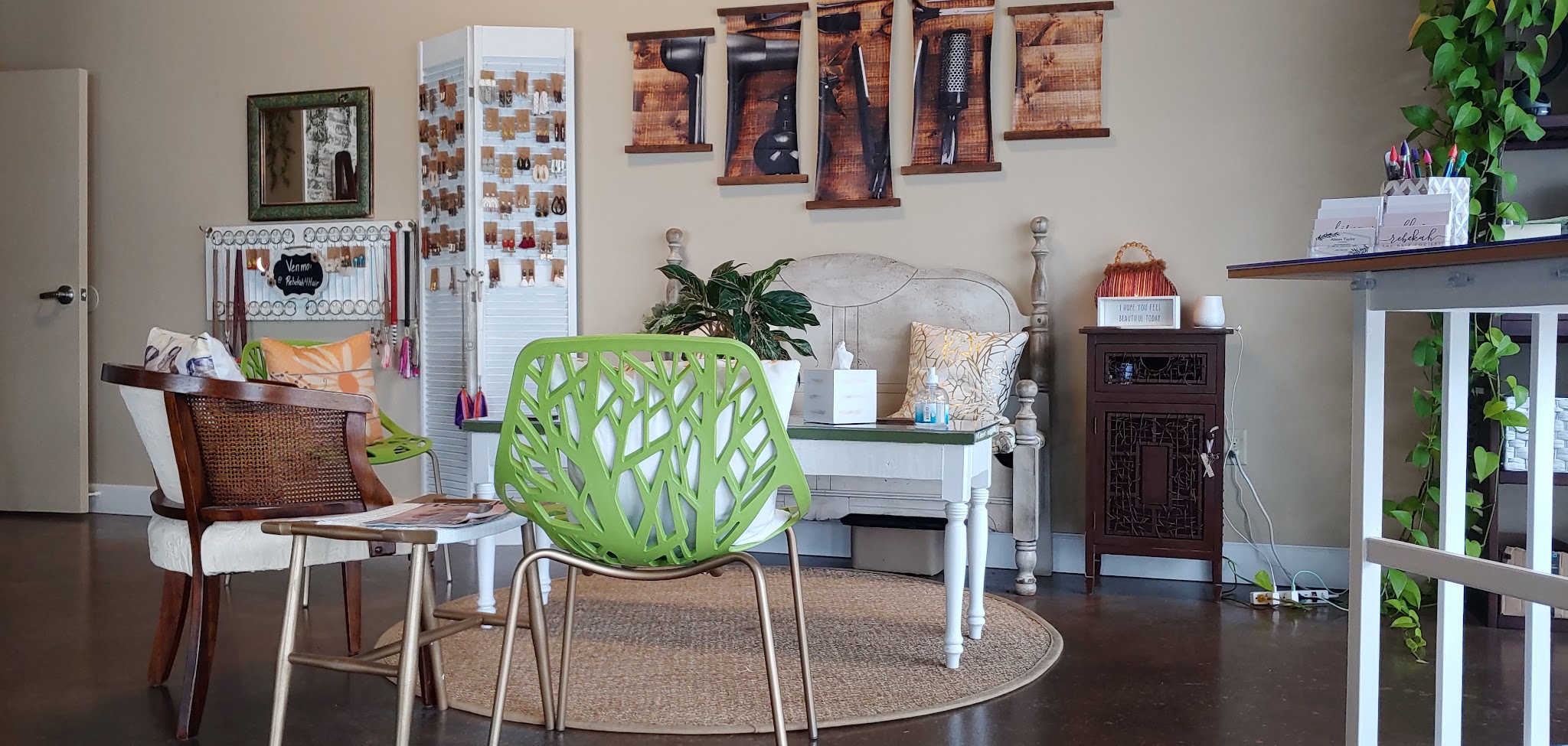 The salon waiting area with seating and shelves